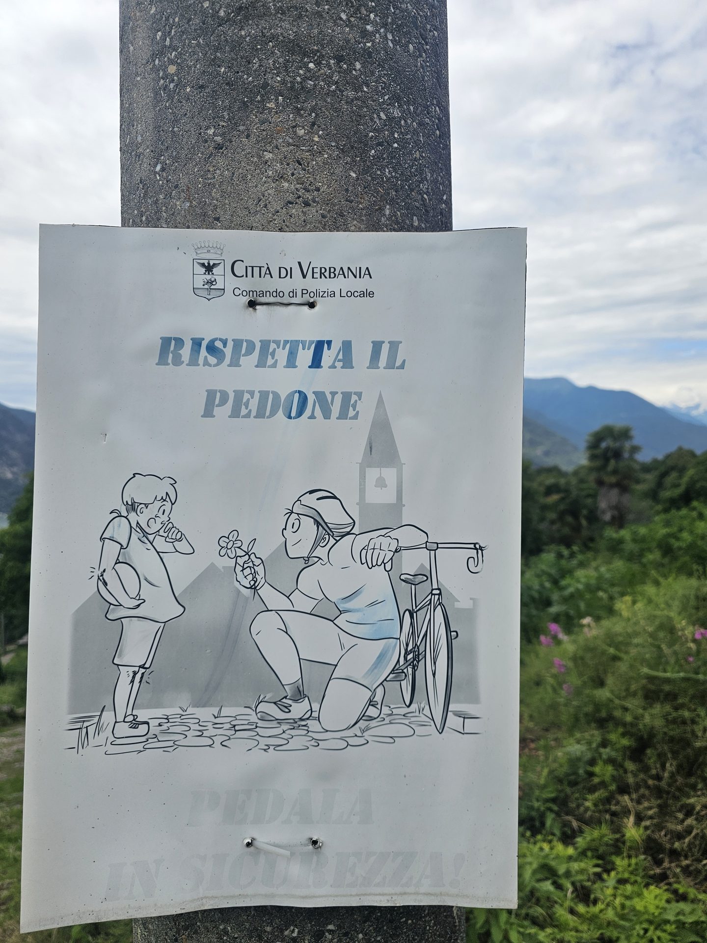 A 'Rispetta il pedone' respect-the-pedestrian sign in Verbania